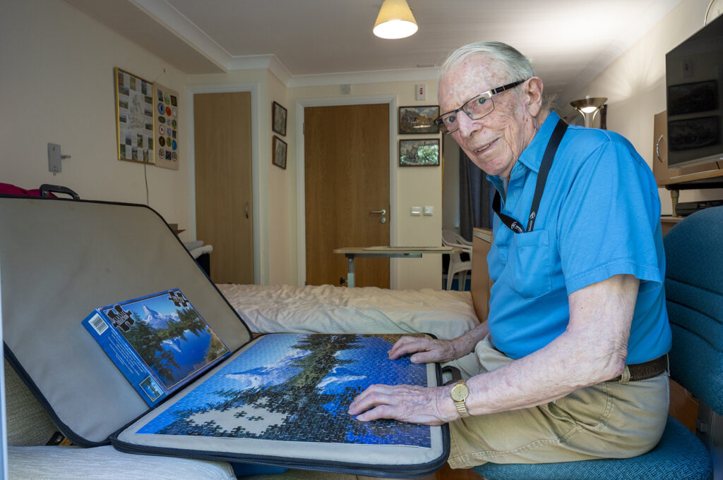 Otterbourne Hill Care Home Resident Completing Puzzle (Expiry July 2029)